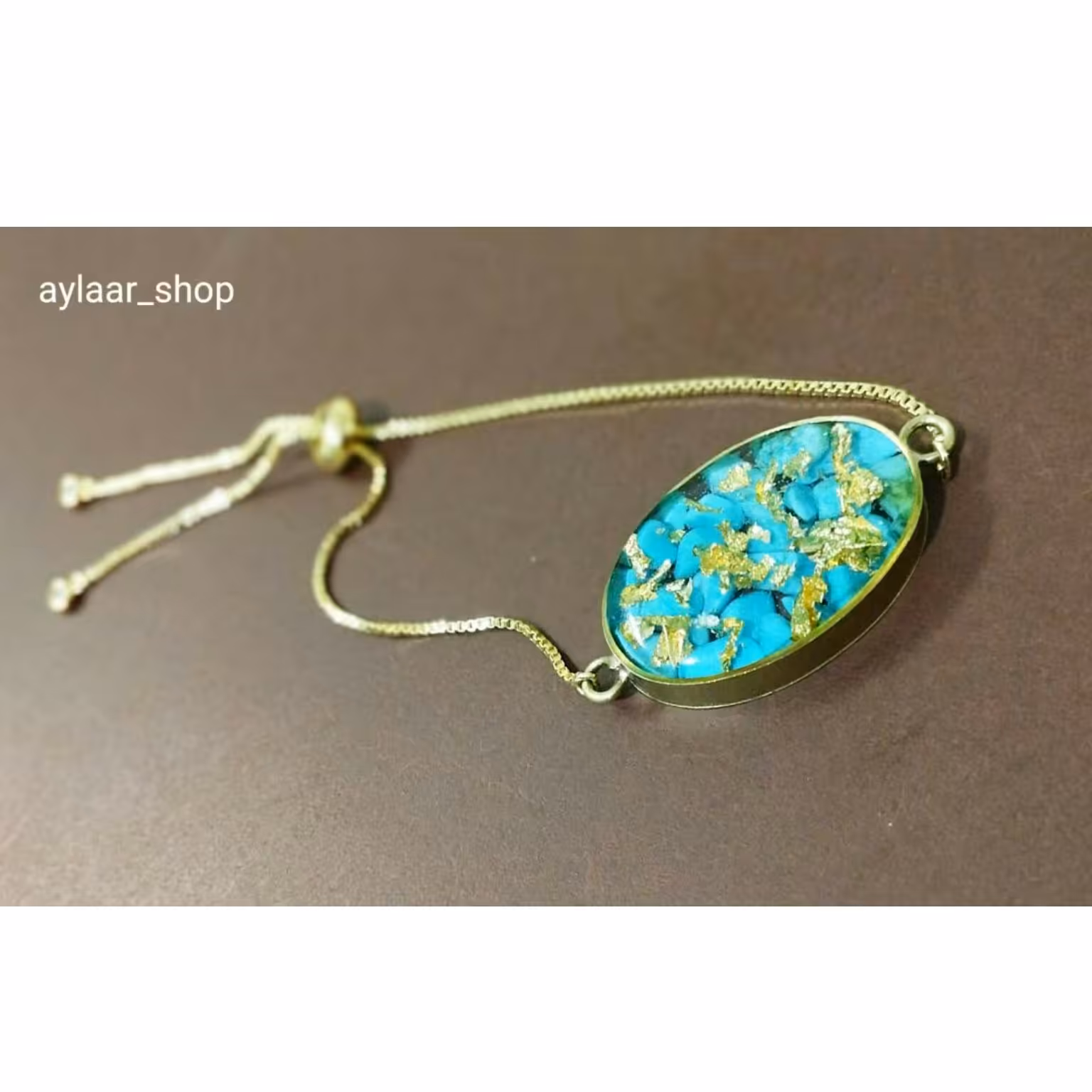 دستبند رزینی طرح فیروزه با زنجیر آسانسور ی