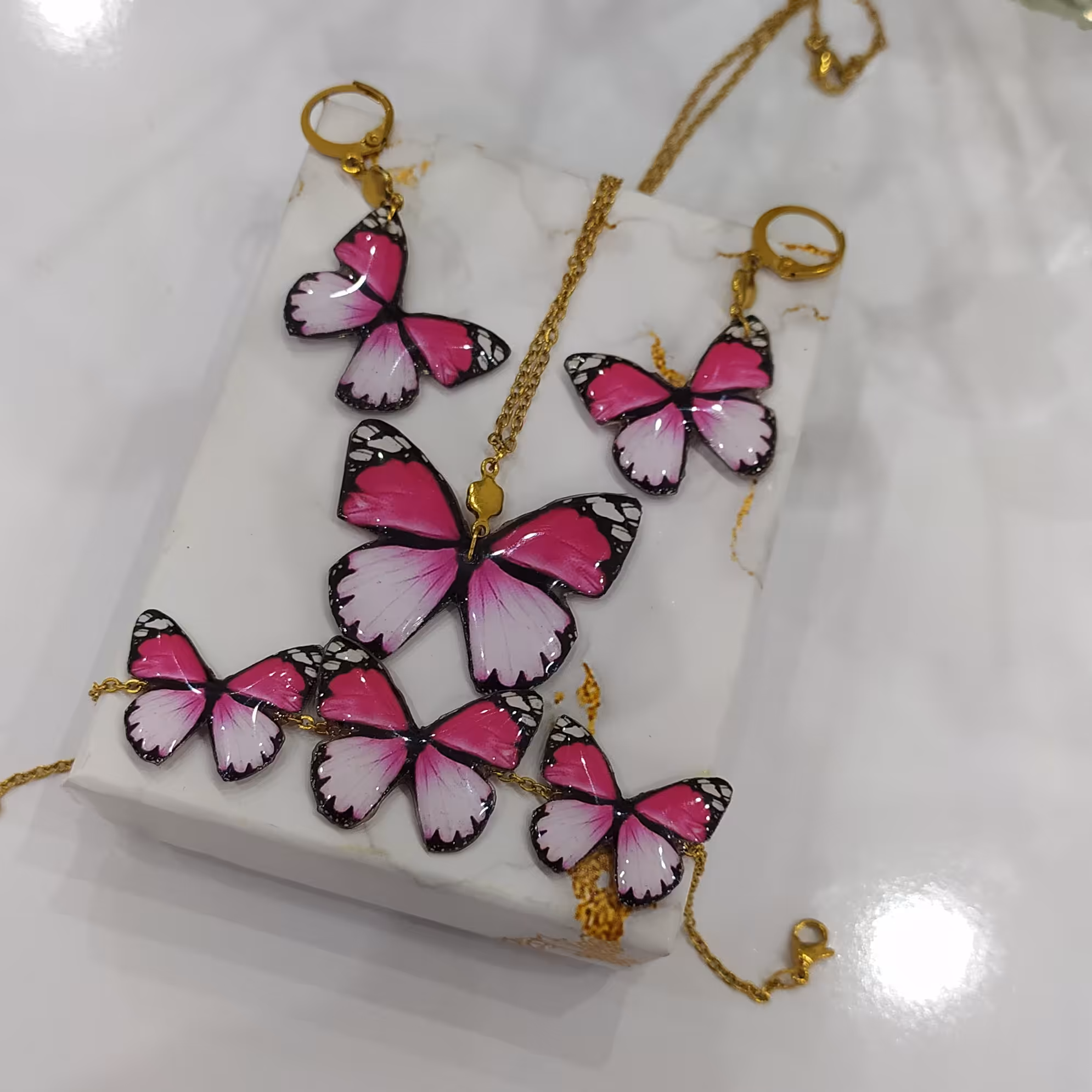 ست زیورالات پروانه صورتی