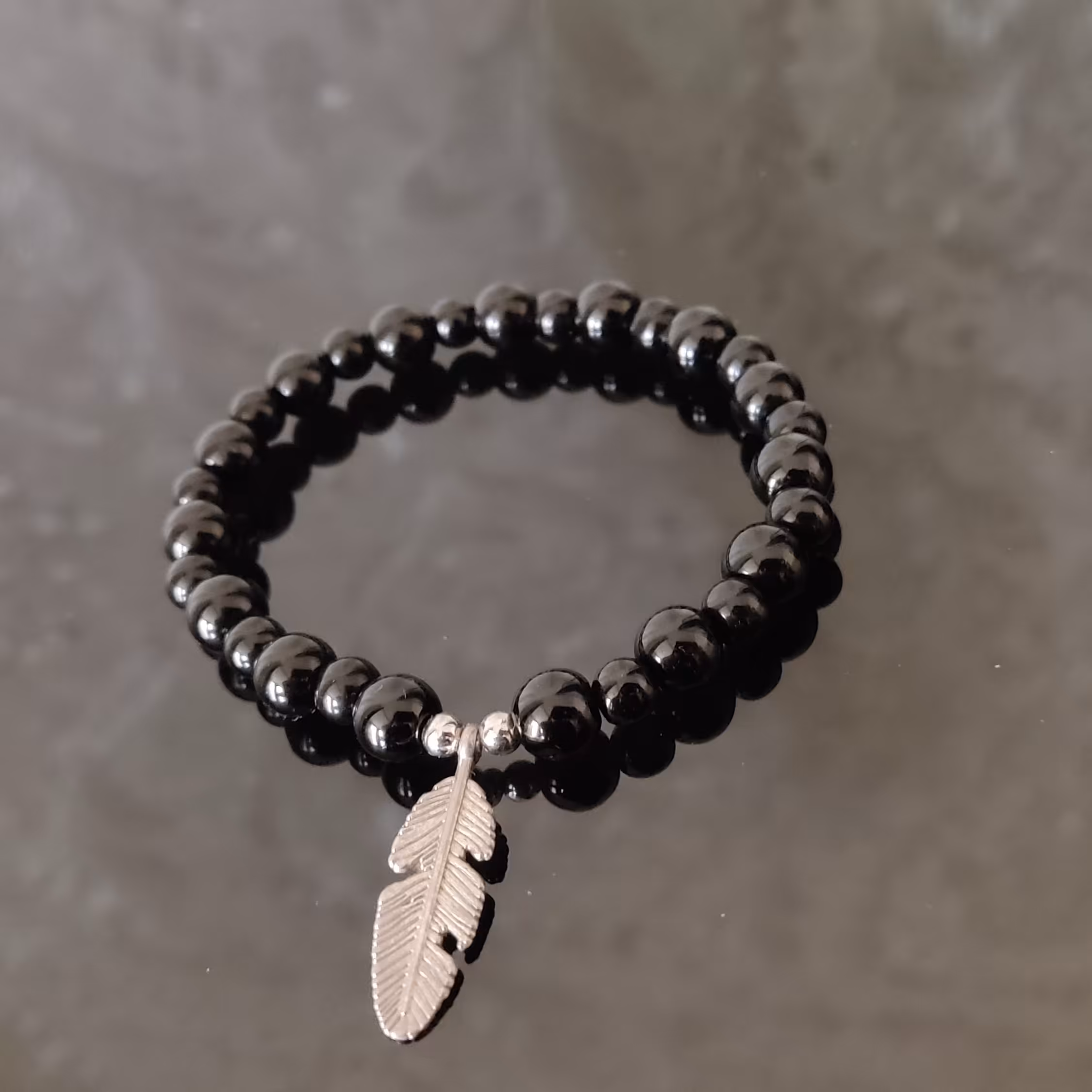 دستبند سنگ اونیکس مشکی براق و پر استیل مردانه و زنانه 