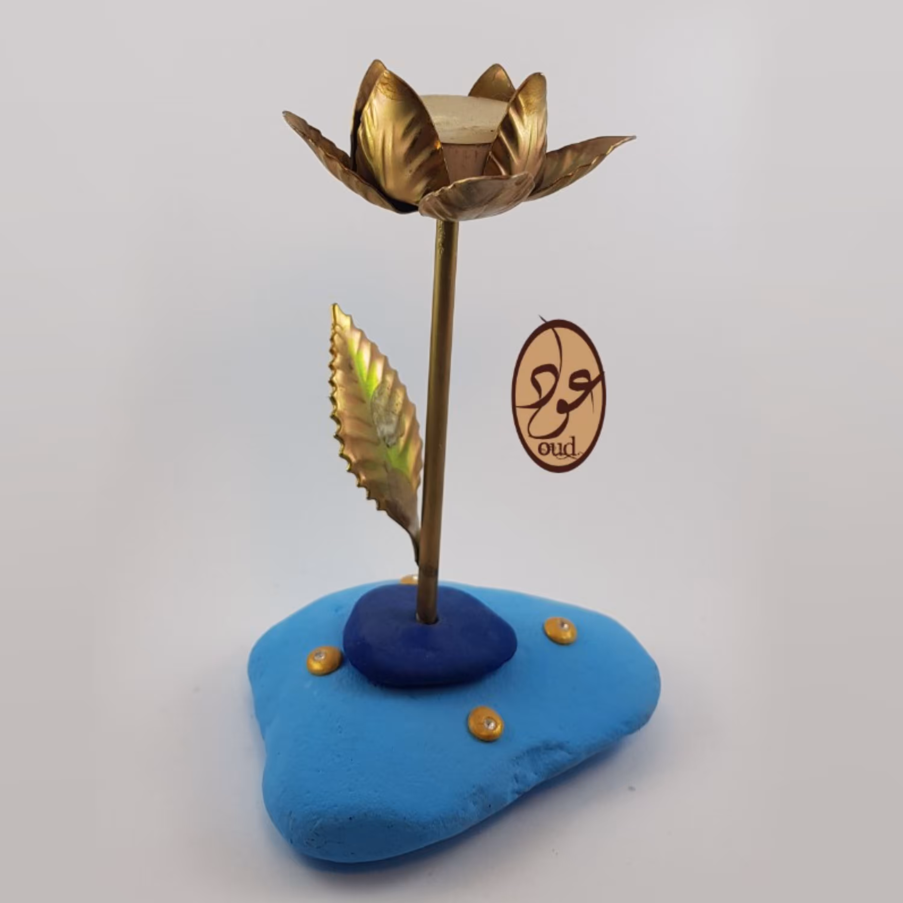 جا شمعی سنگ و فلز با گل طلایی