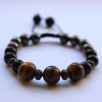 دستبند خرداد ماه مهردخت اکسسوریز. ترکیبی از. مگنتیت.چشم ببر.اونیکس و حدید