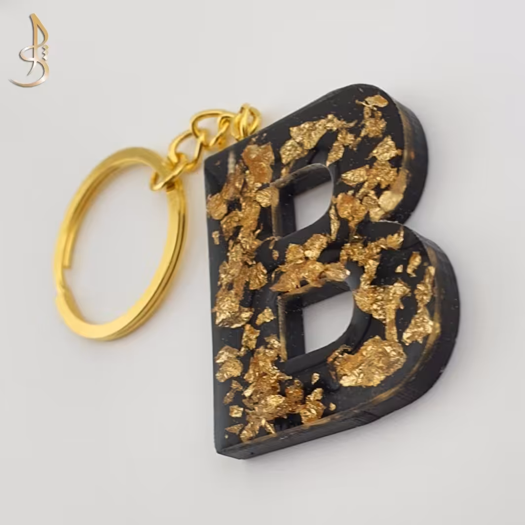 جاکلیدی رزینی حروف انگلیسی حرف B   مشکی و ورق طلایی کد 001