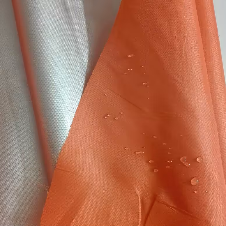 پارچه شمعی نارنجی روشن پشت نقره ای عرض 150 سانت  آرین کاور