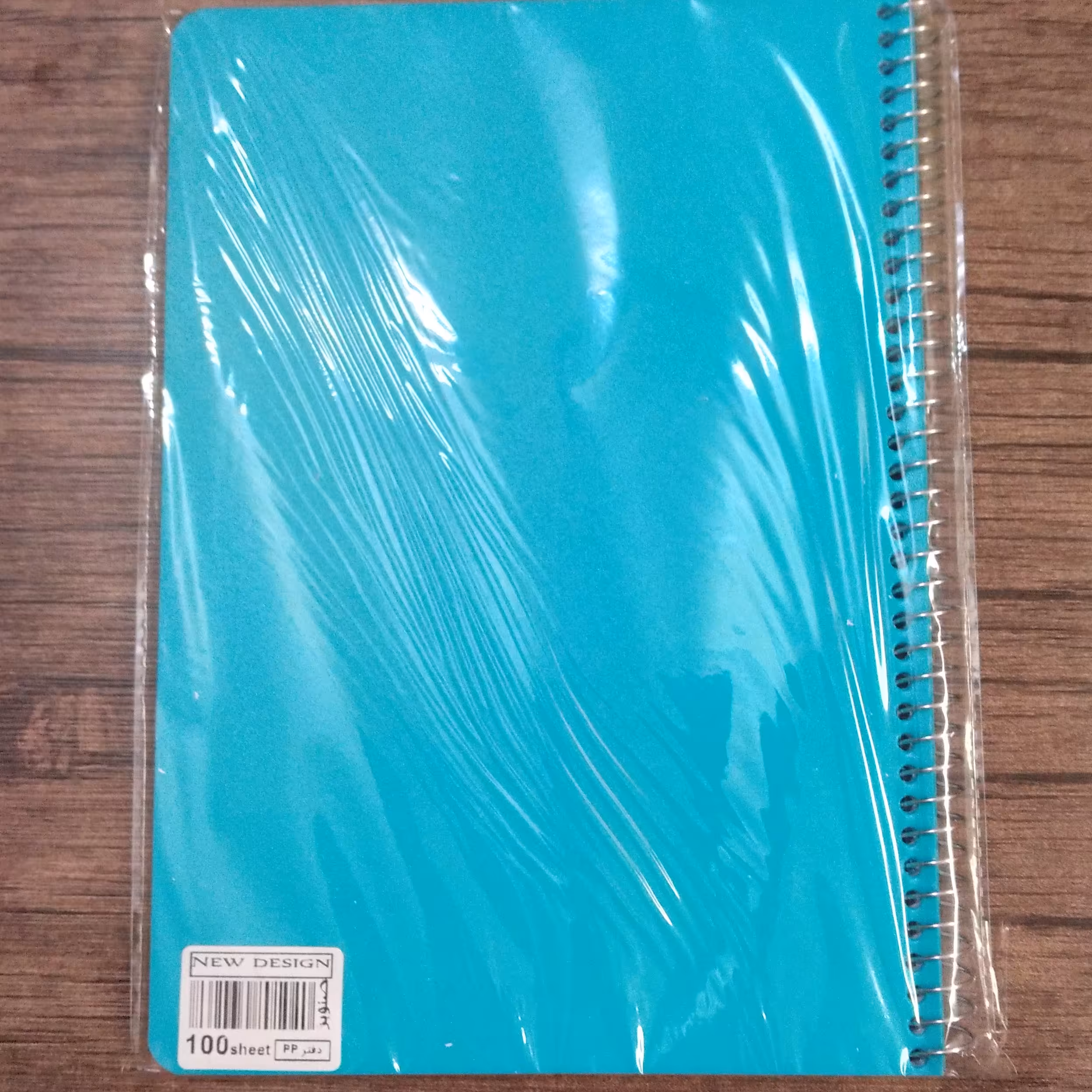 دفتر مشق 100 برگ سیمی صنوبر طرح ساده جلد طلقی رنگ سبز ابی