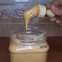 کره ی بادام زمینی ساده  ،غلیظ و خوش طعم، در قوطی های 400 گرمی