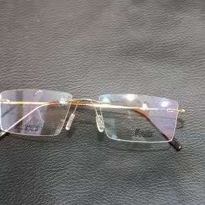 عینک طبی بی فریم طلایی