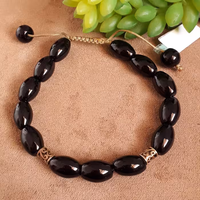 دستبند سنگ اونیکس مدل بیضی و رینگ های نقره