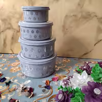 ظرف فریزری رزمن مدل گرد  طوسی با گلهای نقره ای  4تکه هرتکه دارای درب جدا 