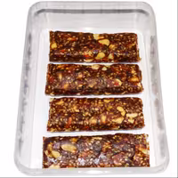 معجون خرما بار بادام زمینی و کنجد بازار دهکده بسته 4 عددی