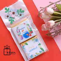 بسته دوتائی شکلات کادویی مربعی 3در3 طرح نوروزی باتزیین شکوفه های بهاری1