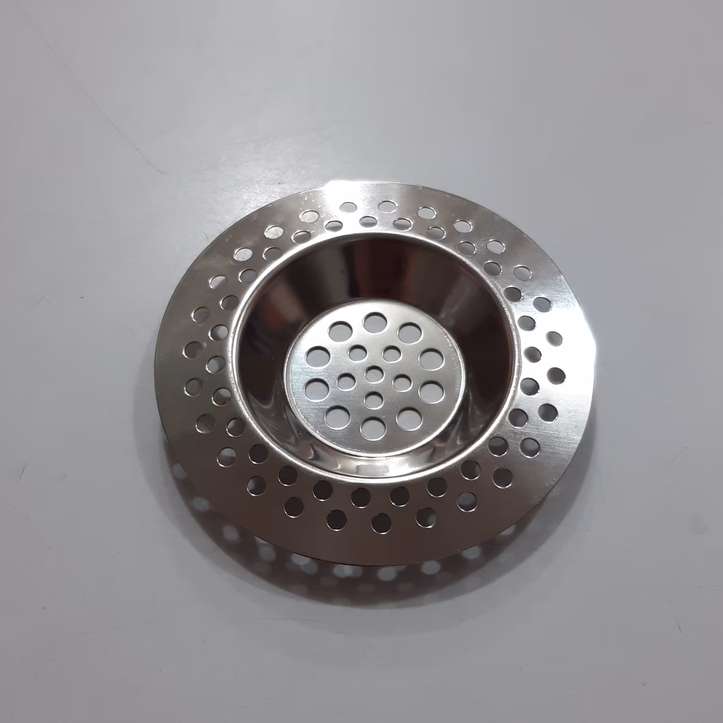 توری کوچک ظرفشویی استیل صافی آشغال گیر و راه آب لوازم آشپزخانه نگار 