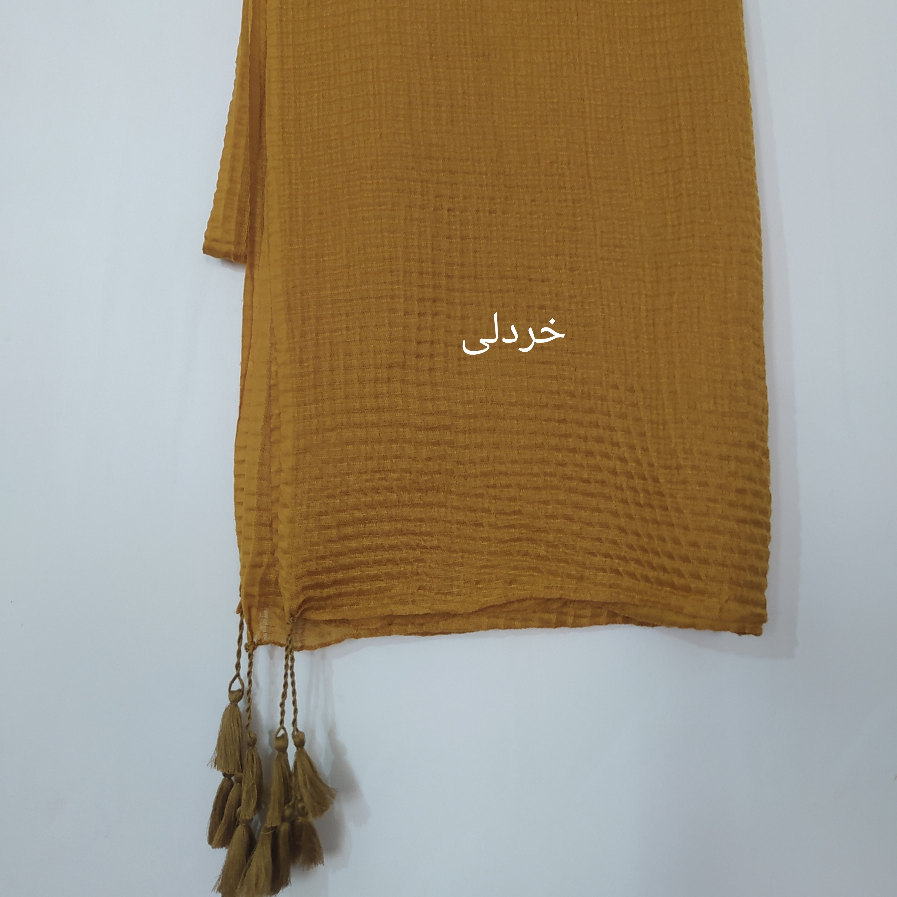 شال هنرمندی پلیسه مربعی منگوله دار ابعاد 230در70 رنگ خردلی موجود در 15رنگ شیک(خرید بالای 350 رایگانه ارسالش) 