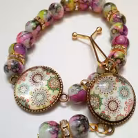 ست دستبند و گیره بنفش با طرح خورشیدی