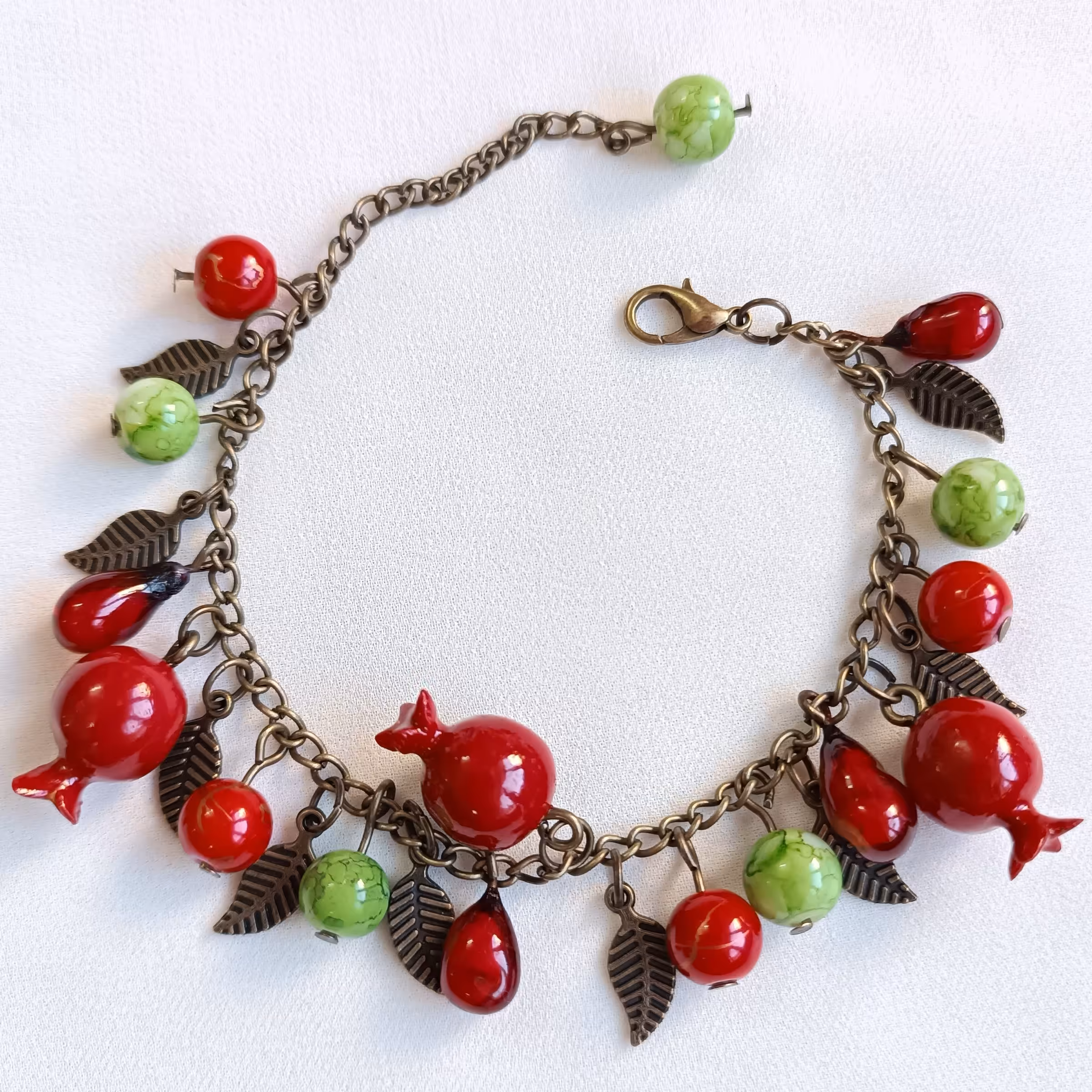 دستبند انار و دانه انار یلدایی قابل تنظیم سایز  برنزی صنایع دستی بدلیجات زیورآلات دستساز سنتی خاص یلدا یلدایی 