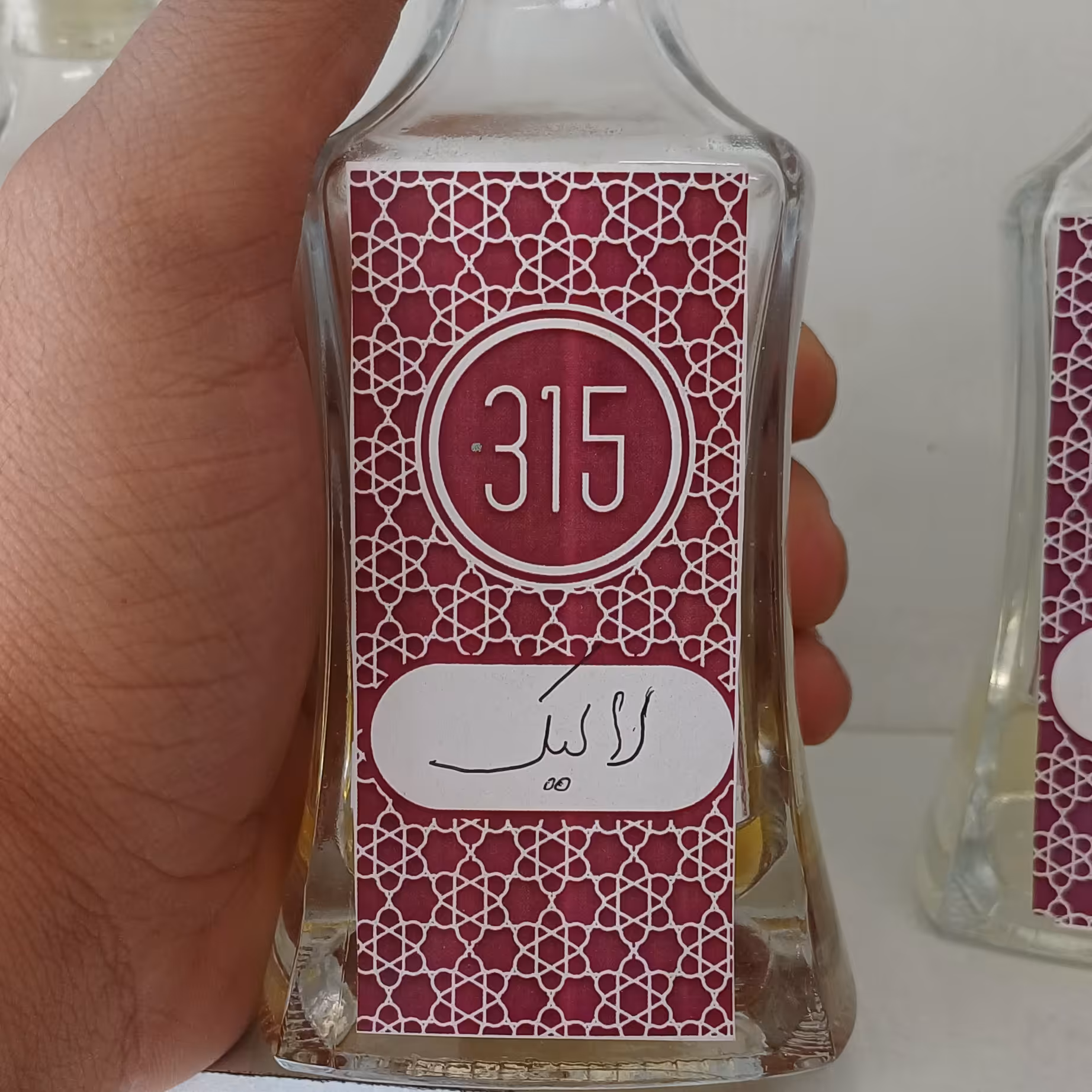 عطر گرمی لالیک بلک با ماندگاری بالا
