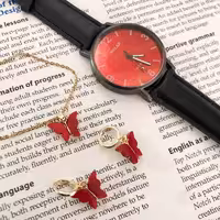 نیم ست پروانه قرمز طلایی و ساعت والار بند چرمی صفحه قرمز 