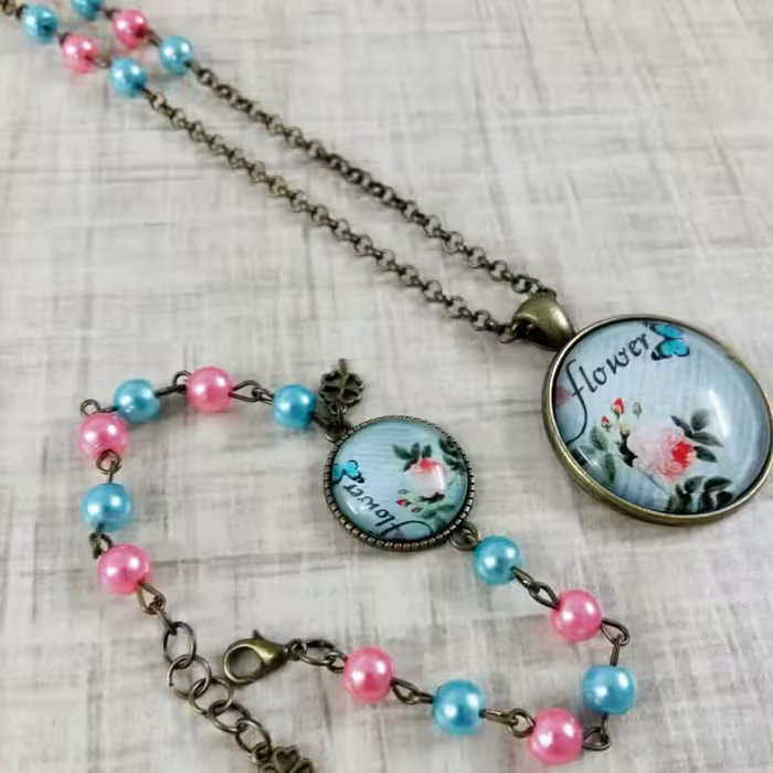 ست گردنبند و دستبند رزین آبی وصورتی