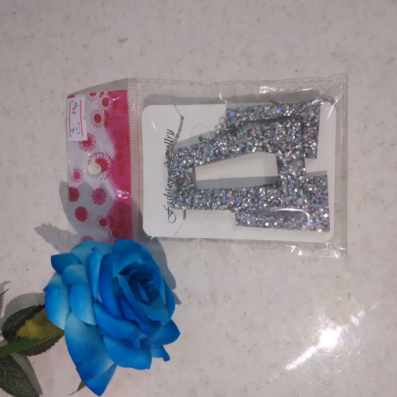 بدلیجات نیم ست رزینی نقره ای با زنجیر استیل رنگ ثابت