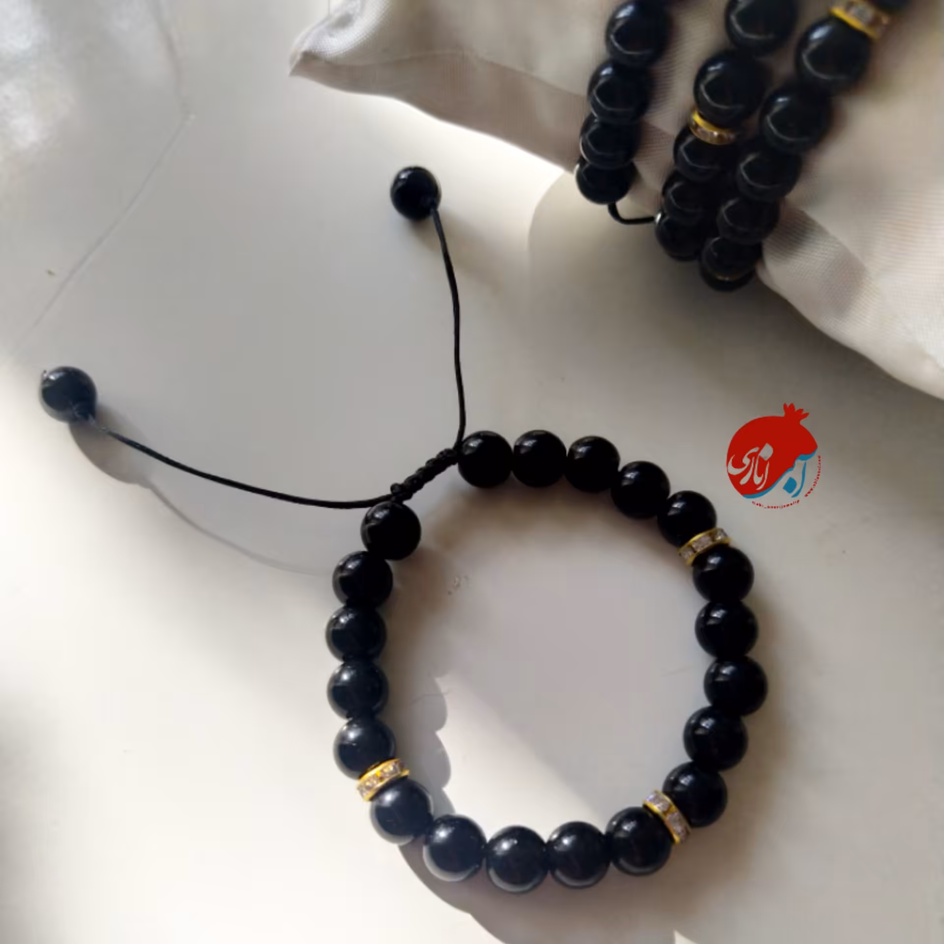 دستبند مشکی با رینگ نگین دار 