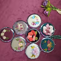 آینه استیل  تاشو روباندوزی.یکطرف با بزرگنمایی بیشتر