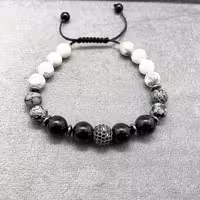 دستبند سنگ عقیق و آبسدین و هائولیت و گوی سواروسکی