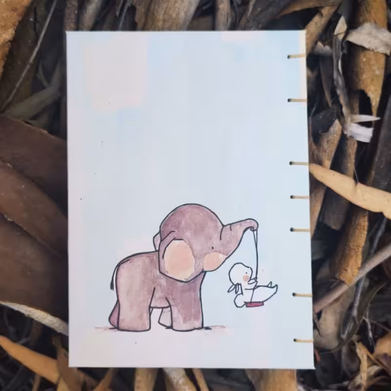 دفتر  80 برگ فانتزی دستساز نارنگی طرح فیل و خرگوش 1