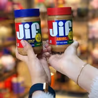 کره بادام زمینی جیف 454 گرمی درب آبی حاوی تیکه های بادام زمینی درب قرمز  بدون تیکه ب