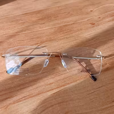 عینک طبی بی فریم طلایی