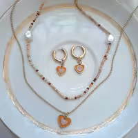 نیم ست شامل گردنبند دولاین و گوشواره برند اروپایی