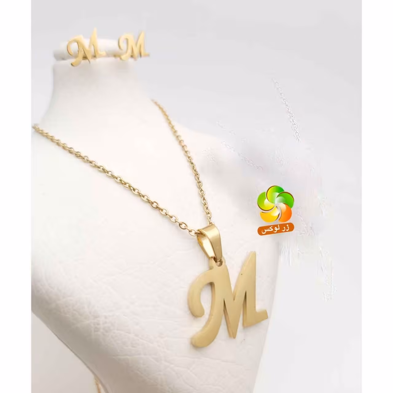 نیم ست حرف m استیل طلایی