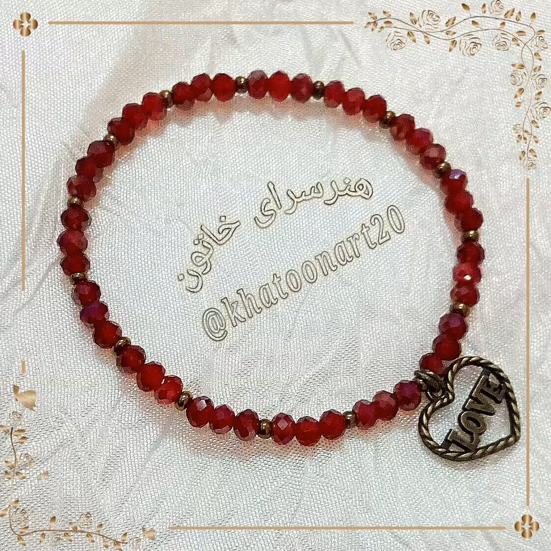 دستبند زرشکی با آویز قلبی