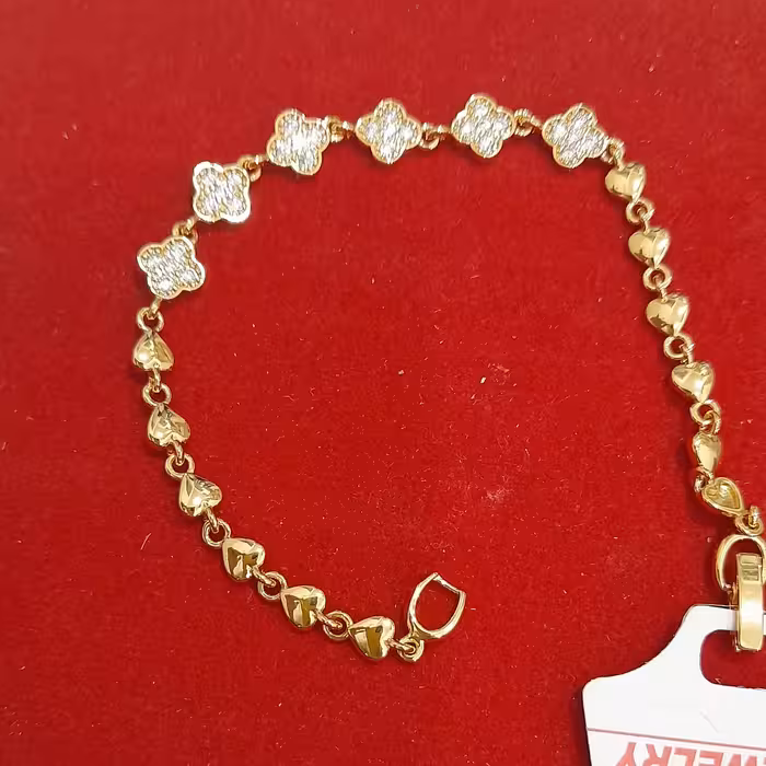 دستبند برندCM طلایی رنگ ثابت طرح شکوفه ،قلب ریز