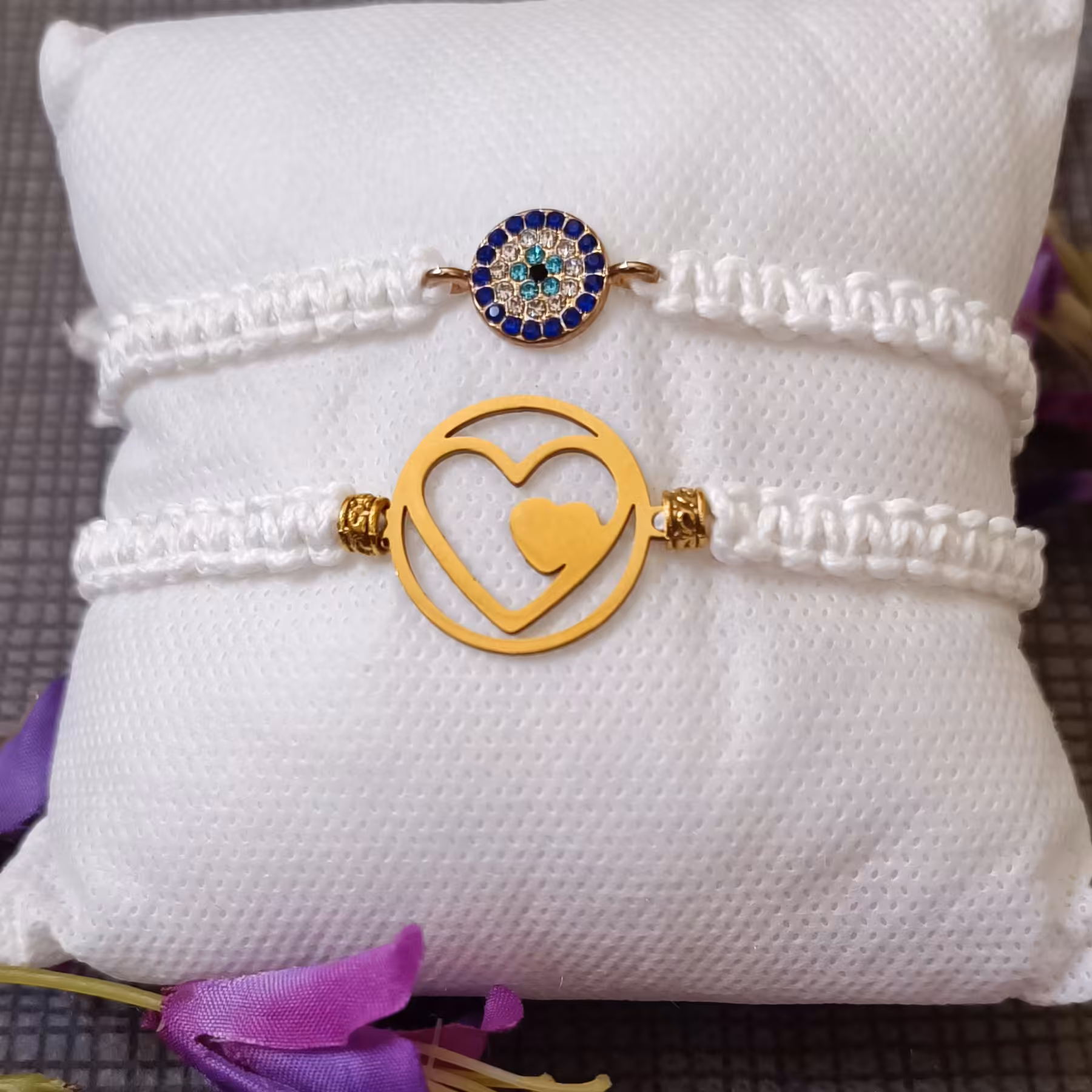 دستبند دو تایی پلاک استیل طلایی و یک دستبند با مهره چشم زخم 