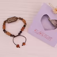 دستبند گرهی مذهبی طرح شکر خدا را که در پناه حسینم ،کتیبه چوب، سنگ چشم ببر و حدید قلبی _ بسیار با کیفیت و خاص