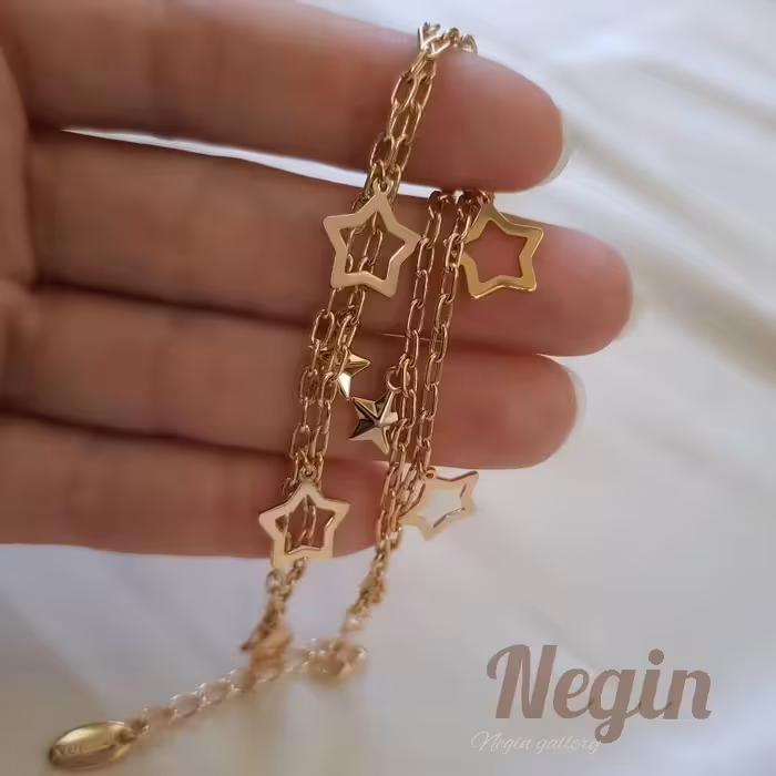 دستبند ژوپینگ دولاین آویز ستاره دار دستبند چند حلقه برای کوچک بزرگ شدن دارد 