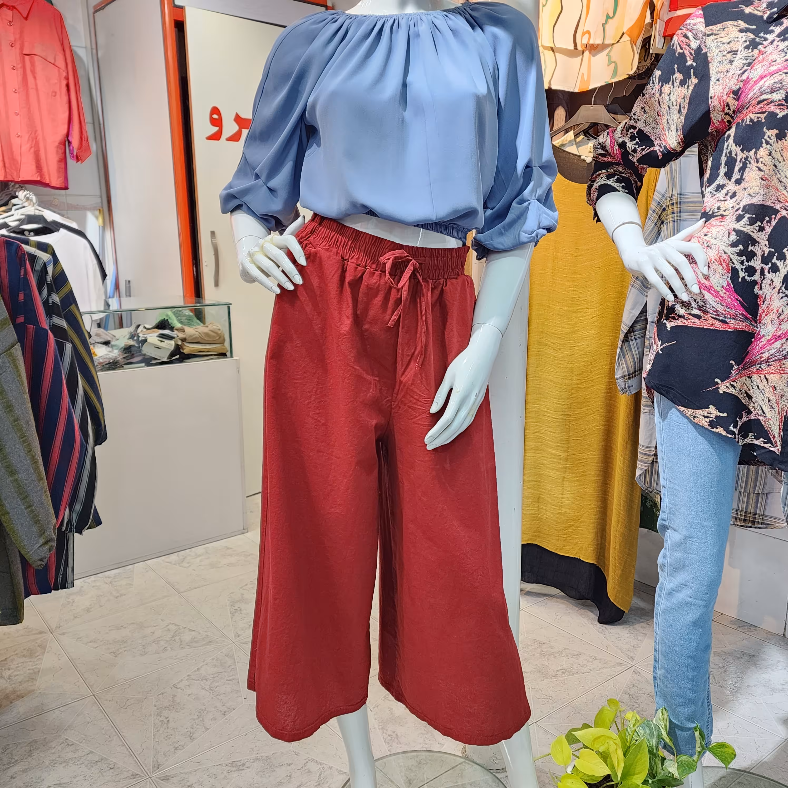 دامن شلواری جنس کنفی فری سایز 38 الی 44 کمر کش جیب دار قد 95 رنگ بندی دارد