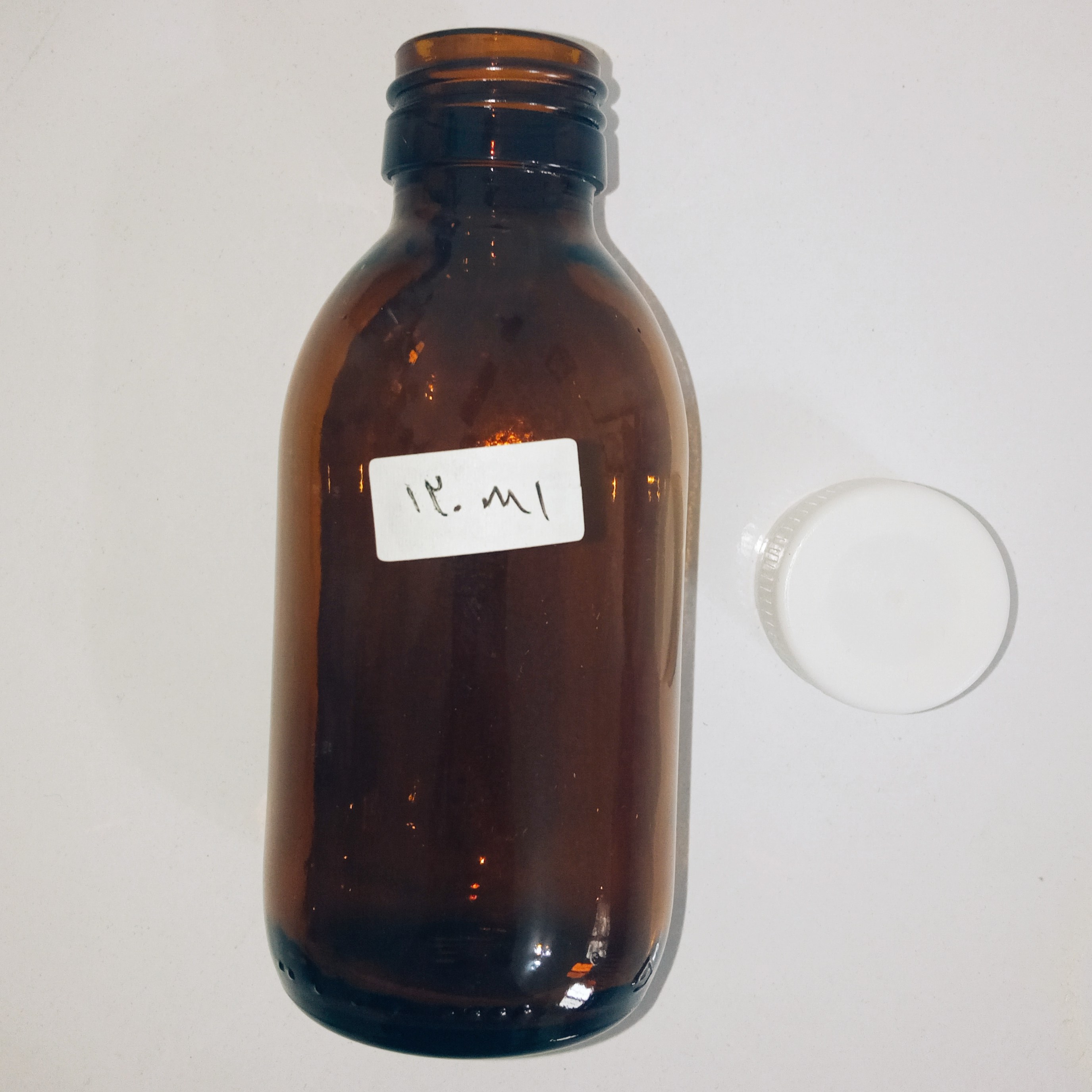 شیشه شربت تیره درجه یک ظرفیت 120ml همراه درب پلمپ
