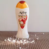 شامپو اکتیو مخصوص موهای آسیب دیده و رنگ شده حاوی عصاره انار و گل همیشه بهار 