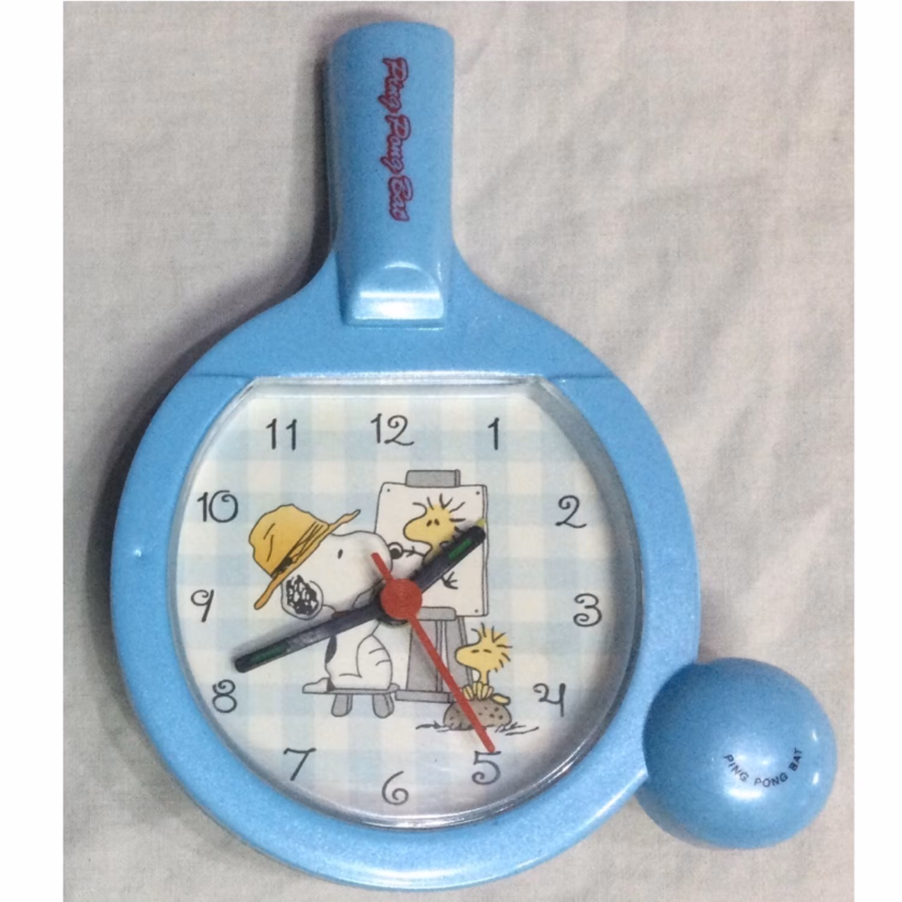 ساعت رومیزی عقربه ای زنگ دار طرح راکت پینگ پنگ