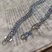 دستبند کارتیر و زنجیر رولو