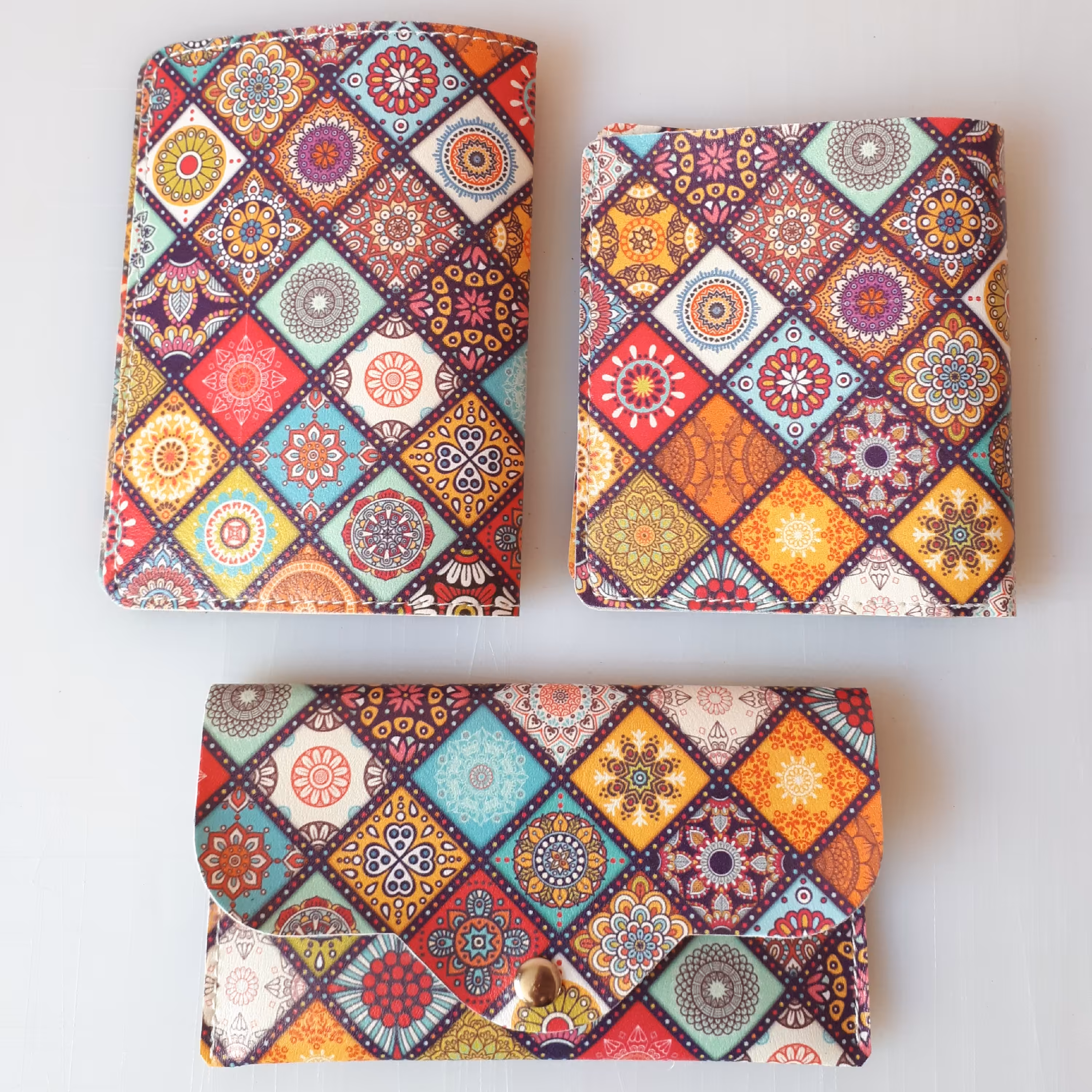 کیف پول، جلد پاسپورت و جادستمالی چرم مصنوعی با طرح فانتزی در طرحهای متنوع