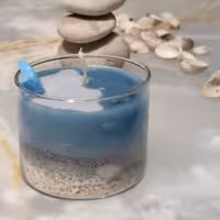 شمع دریایی شفاف با صدف و سنگ و دم ماهی