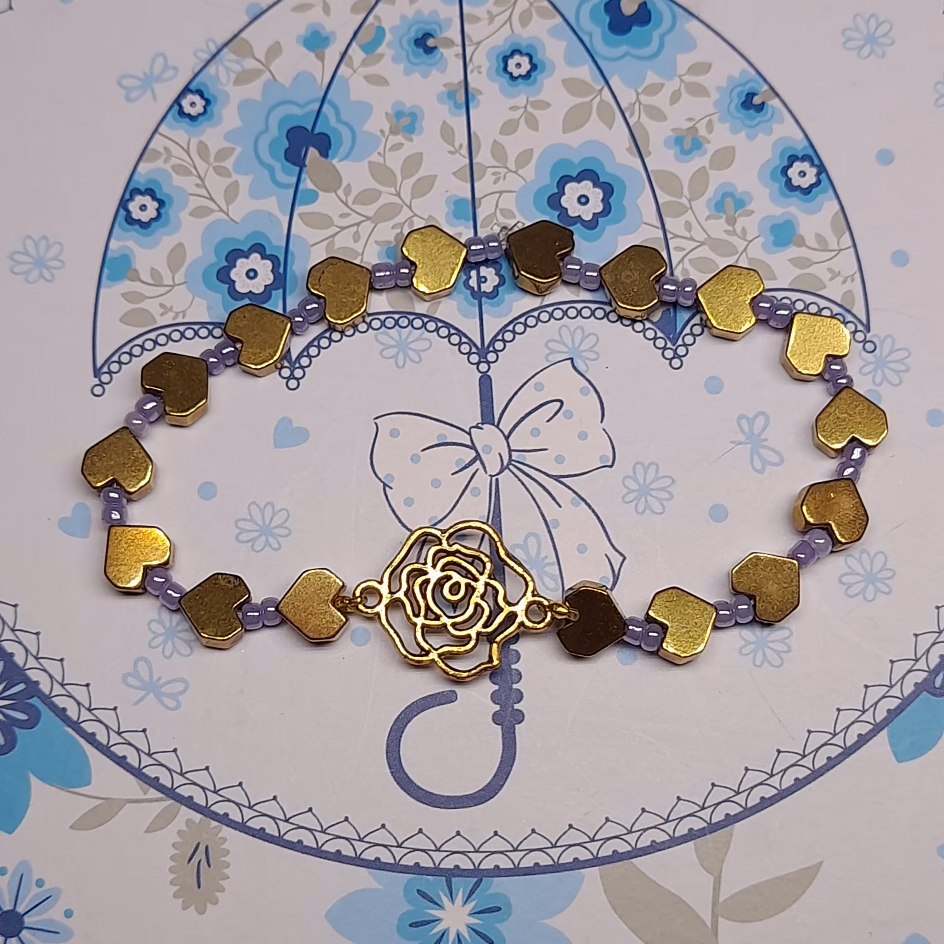 دستبند  حدید و مهره یاسی با طرح گل رز و قلب