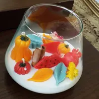 شمع  یلدایی با تزیین انار کدو گل دارچین