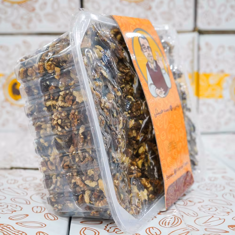 مغز گردو فسنجونی درجه 1 در بسته بندی سیل وکیوم دو بسته 2.25 کیلویی در کارتن