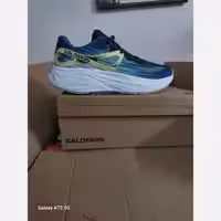 کتونی و کفش سالومون رانینگ کتونی رانینگ سالومون طرح اصلی Salomon Aero Glide White رنگ سبز و آبی ویتنام مستر کوالیتی