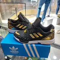 کتونی مشکی طلایی پسرانه و دخترانه آدیداس مدل zx8000