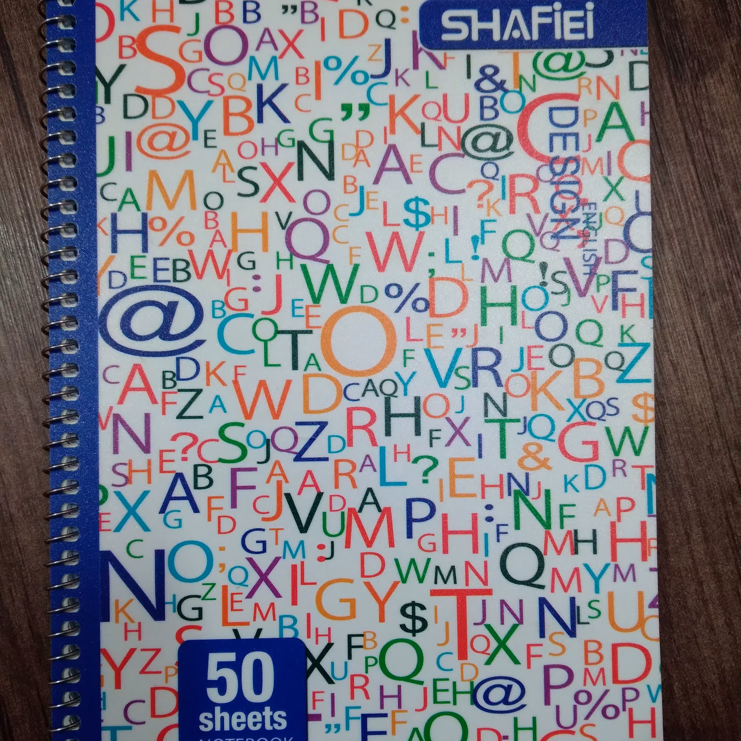 دفتر زبان سیمی 50 برگ طرح حروف الفبا شفیعی جلد طلقی