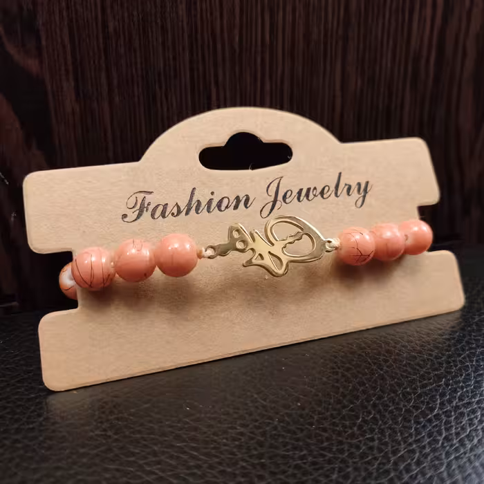 دستبند سنگ گلبهی و پلاک استیل هیچ