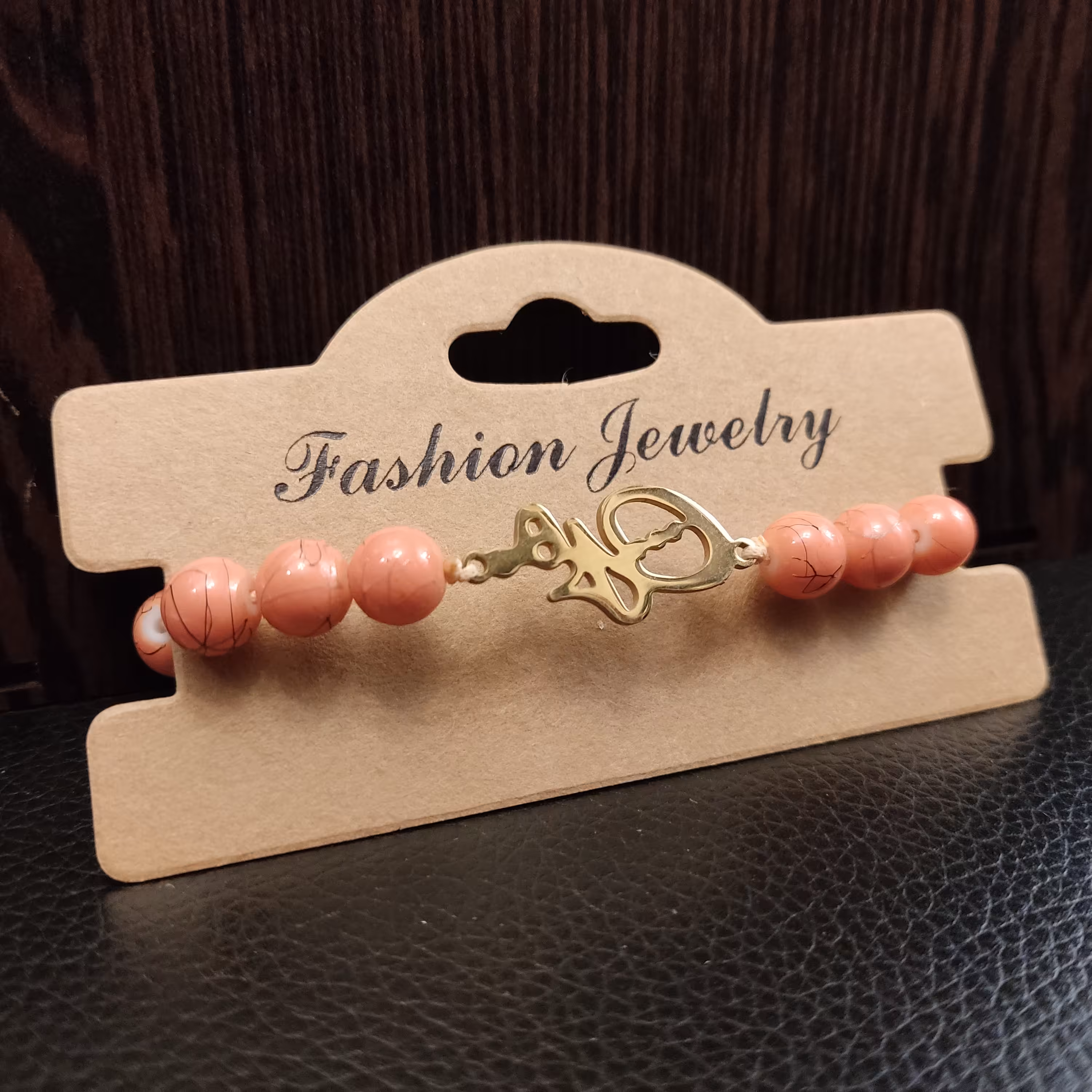 دستبند سنگ گلبهی و پلاک استیل هیچ